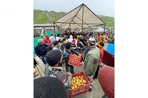 Stranded pilgrims being offered assistance at a relief camp